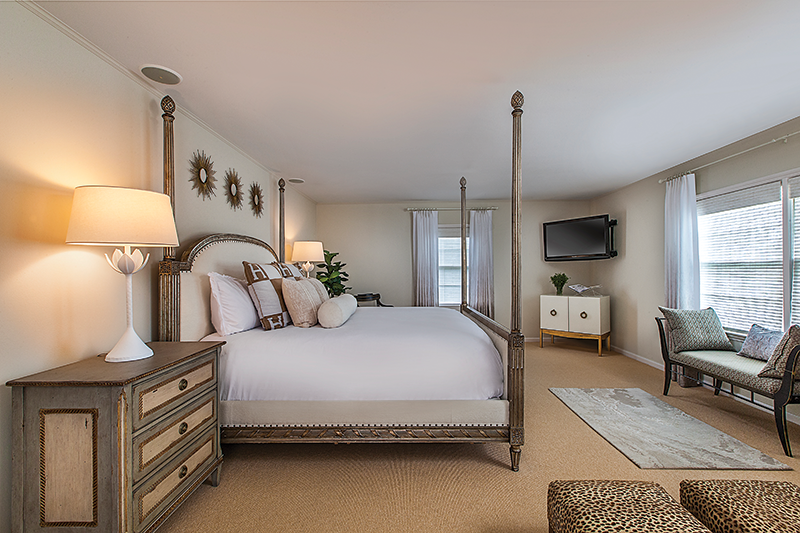 The master bedroom’s palette of easy-on-the-eye neutrals ensures sweet dreams. Note the inviting Louis XVI bed.