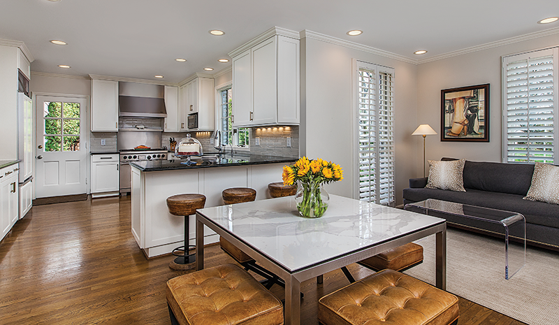 The homeowners didn’t have to change much in the kitchen, although a new backsplash and new cupboard doors/hardware were added.