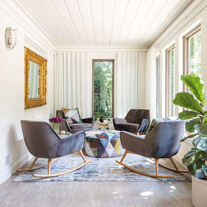 LET THE SUNSHINE IN The sunroom was once an unused space that now is family-central, and looks out to a beautifully landscaped yard. DAS Contracting (www.dascontracting.com) was the builder for the home project and has worked with Long on several projects.