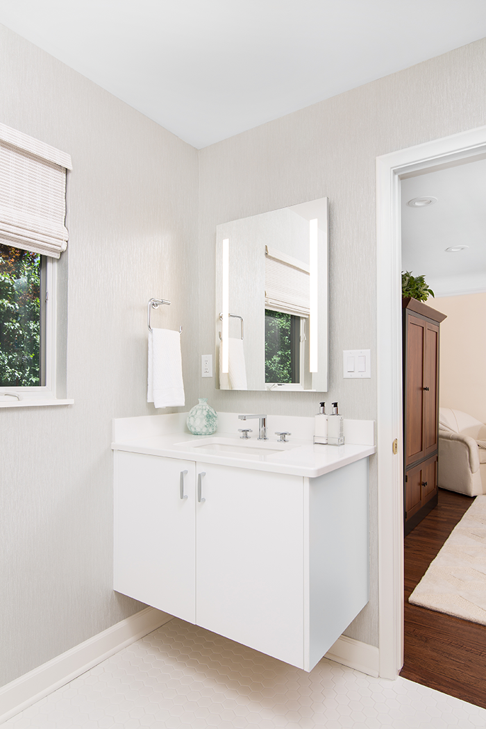 A guest bath is located off the family room, which can double as a guest suite. - Photography by Max Wedge (interiors) and Laura McCaffery (exterior)