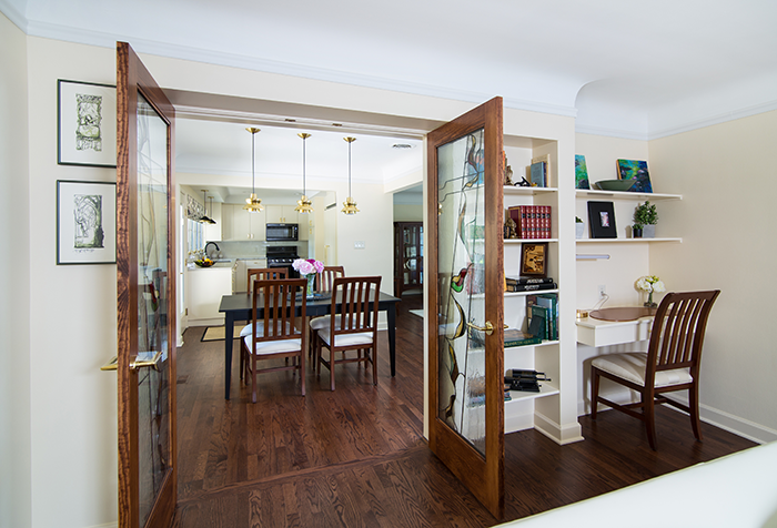 DOUBLE IDENTITY - Custom built-ins in the family room provide additional decorative space. The room can also accommodate overnight guests.