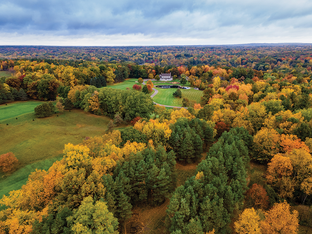 The splendid shades of autumn envelop the Rochester home and its guest houses.