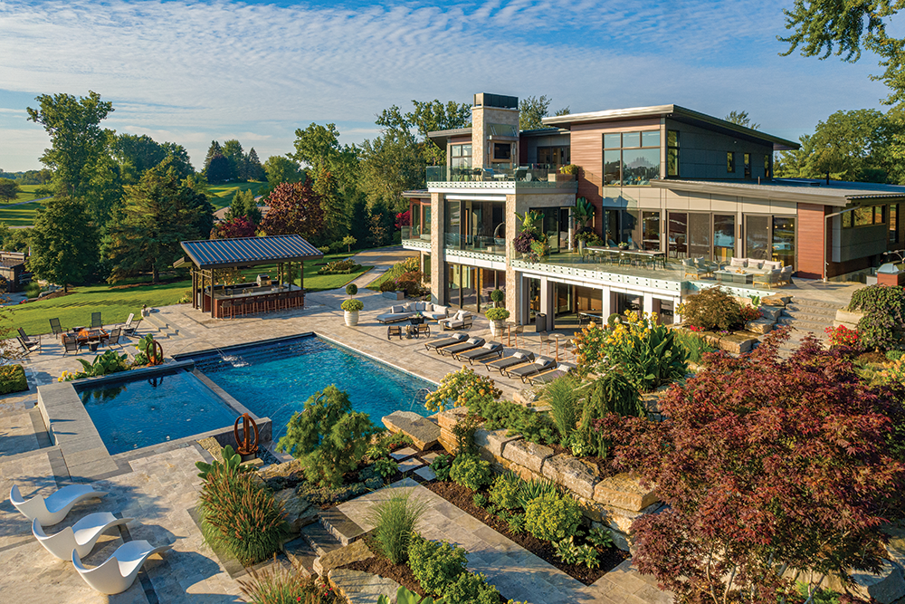 The home, on Silver Lake near Fenton, features outdoor living at its best.
